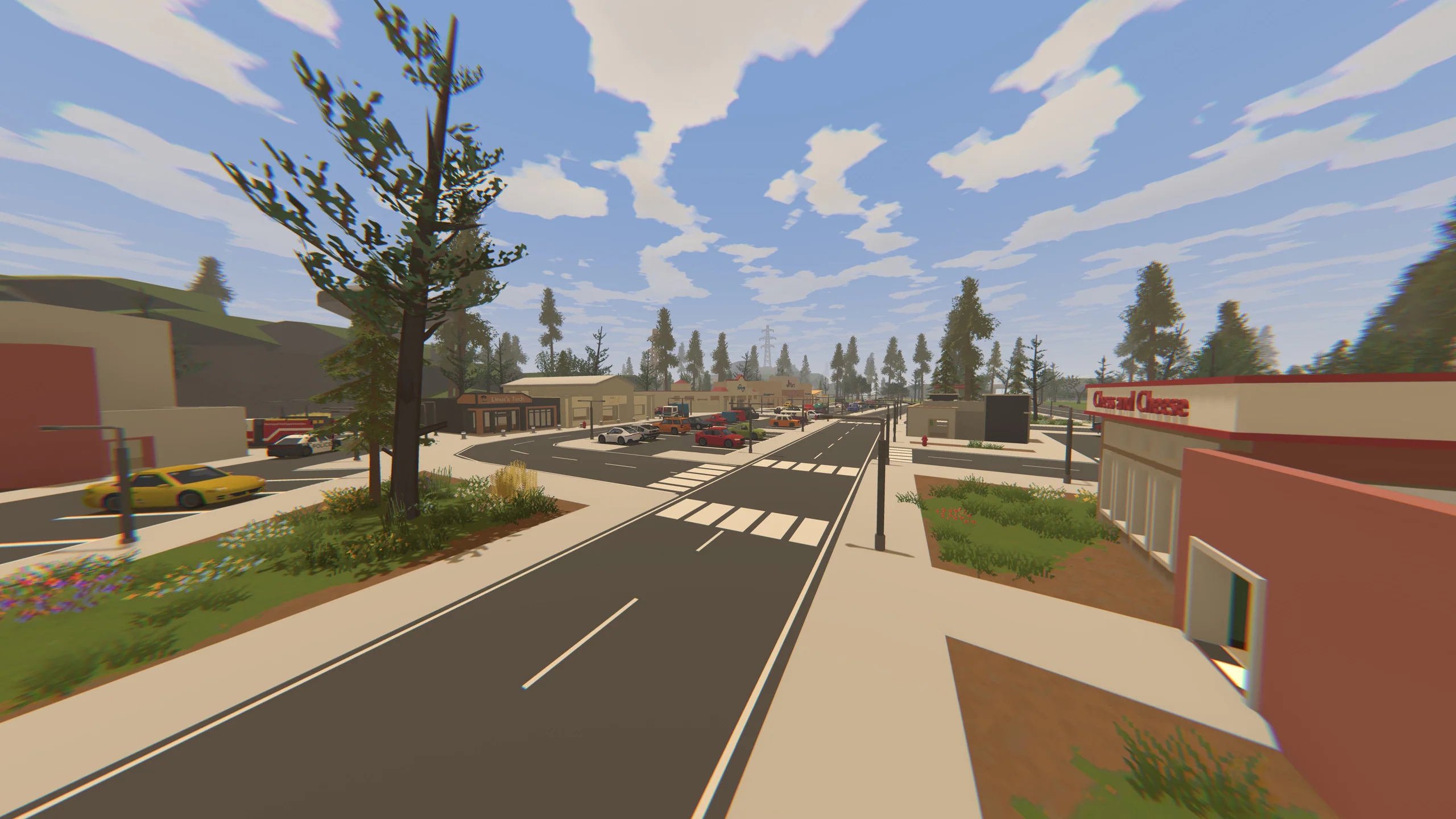 Daytime strip-mall street with a crosswalk and parked cars in front of storefronts